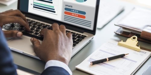 Black businessman using computer laptop